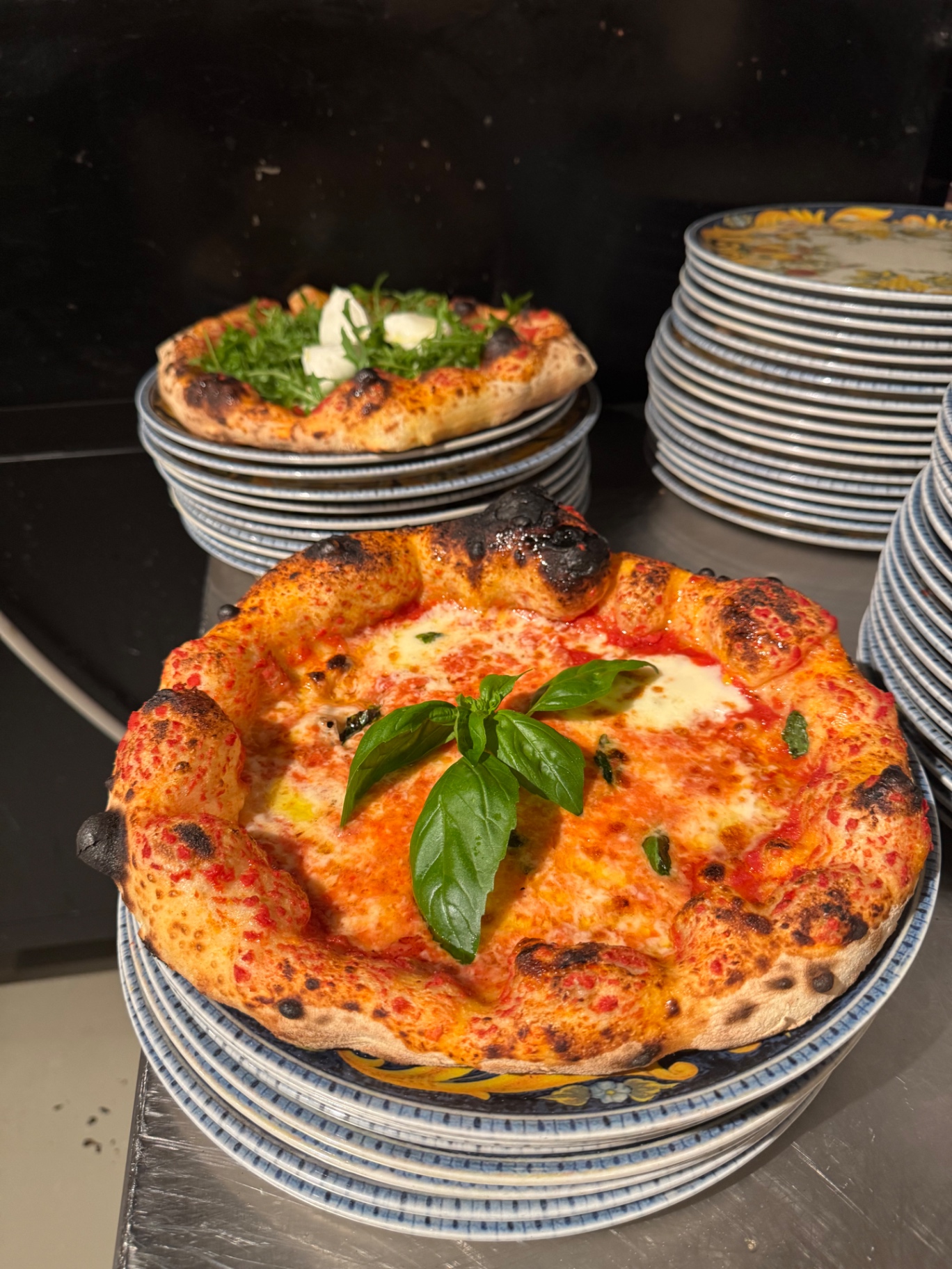 Freshly baked margherita with a leopard-spotted cornicione